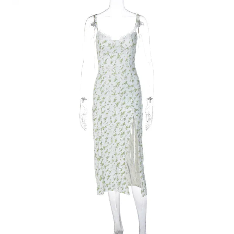 Blue lace flowers print long dress with spaghetti straps and a high leg slit on a mannequin.