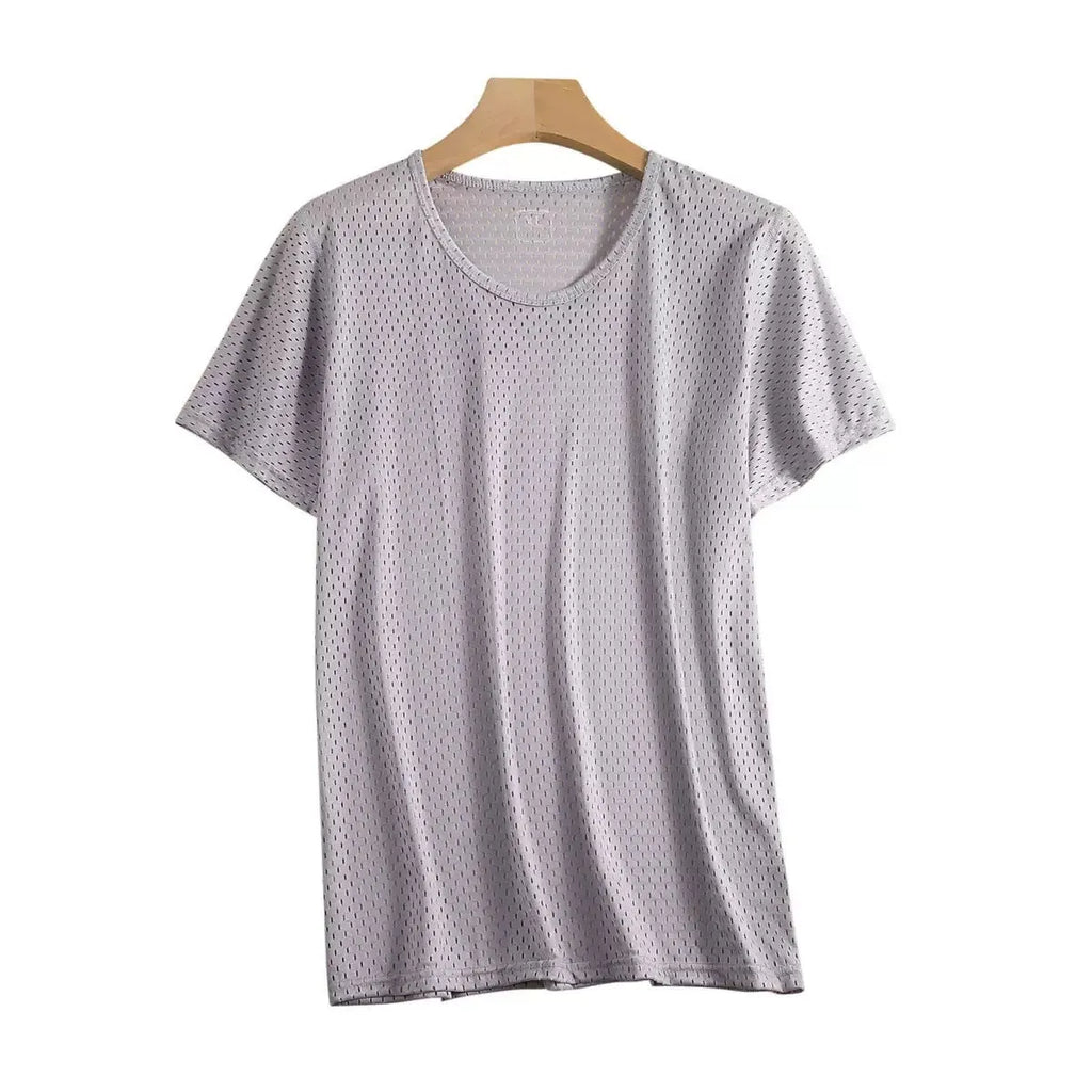 Man wearing a loose-fit ice silk short sleeve T-shirt in a solid colour.