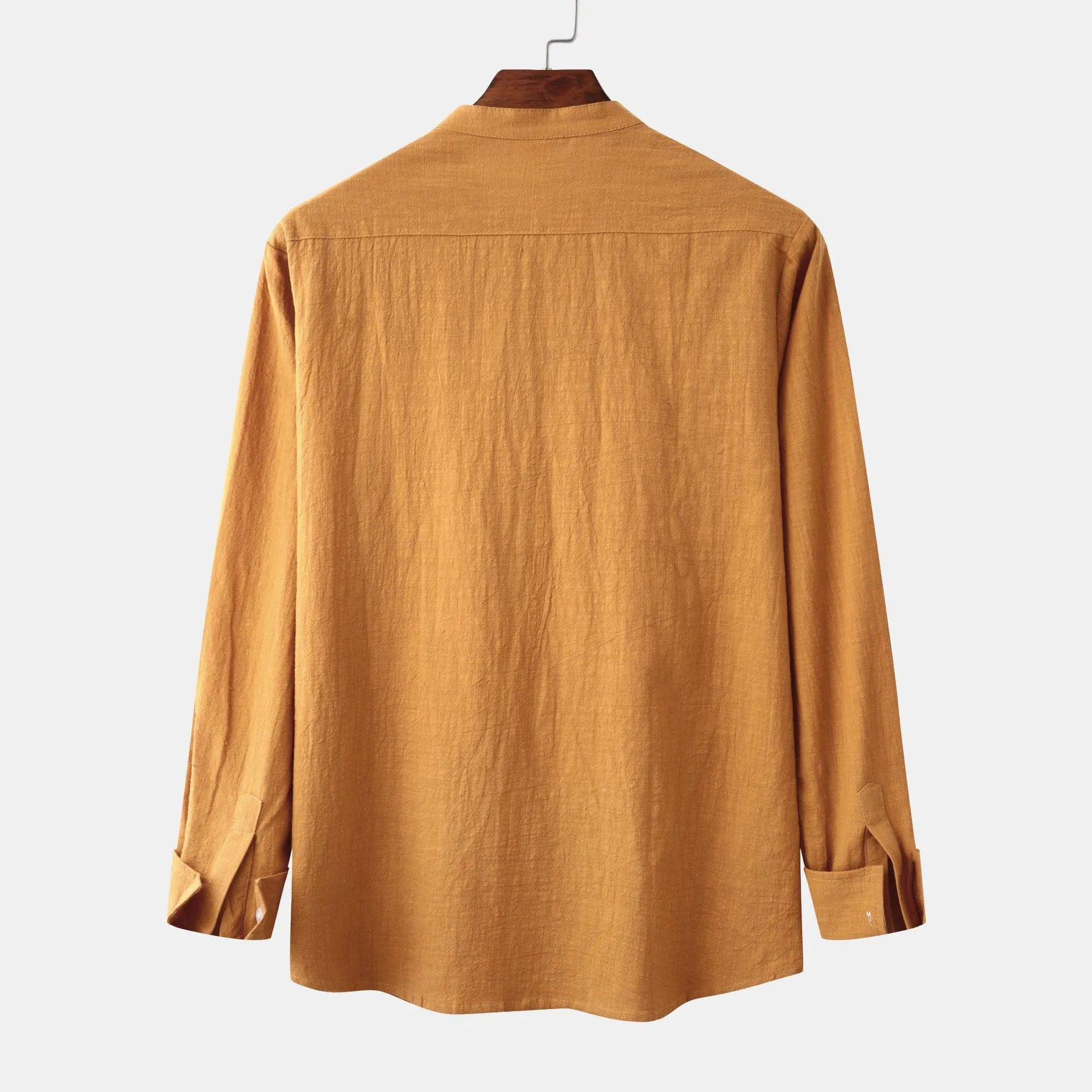 Men's slim fit brown cotton blend long sleeve shirt and pants casual set laid flat.