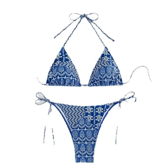 Women's green bandage style bikini swimsuit with split stitching detail on polyester fabric.