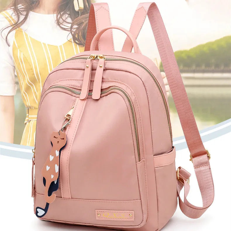 Women's black nylon casual backpack with waterproof construction and anti-theft compartments