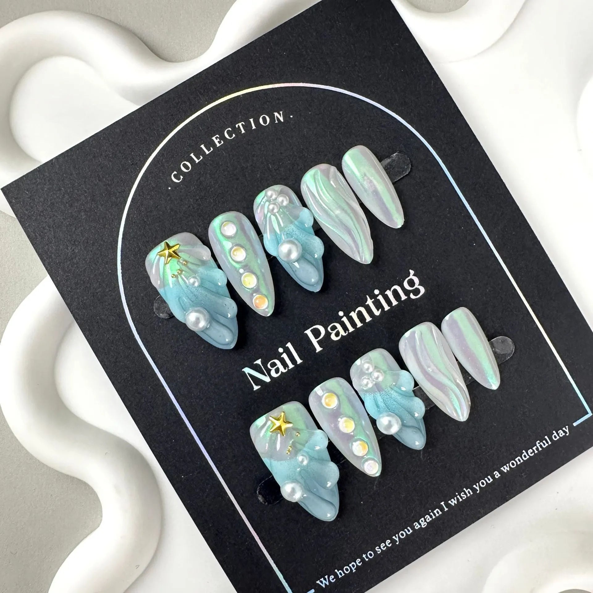 Blue plastic nail tip shells in four sizes for nail extensions and decorative manicures