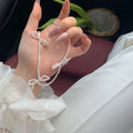 Sweet bow pearl necklace with geometric charm on adjustable 31-40cm chain