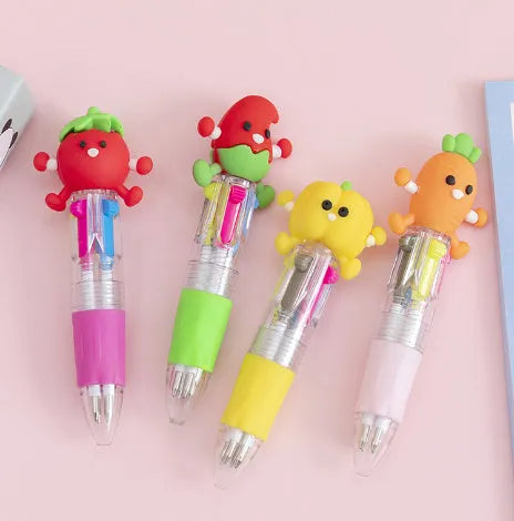 A four-colour ballpoint pen with a press top and a colourful cartoon silicone grip, showing one of five random designs.