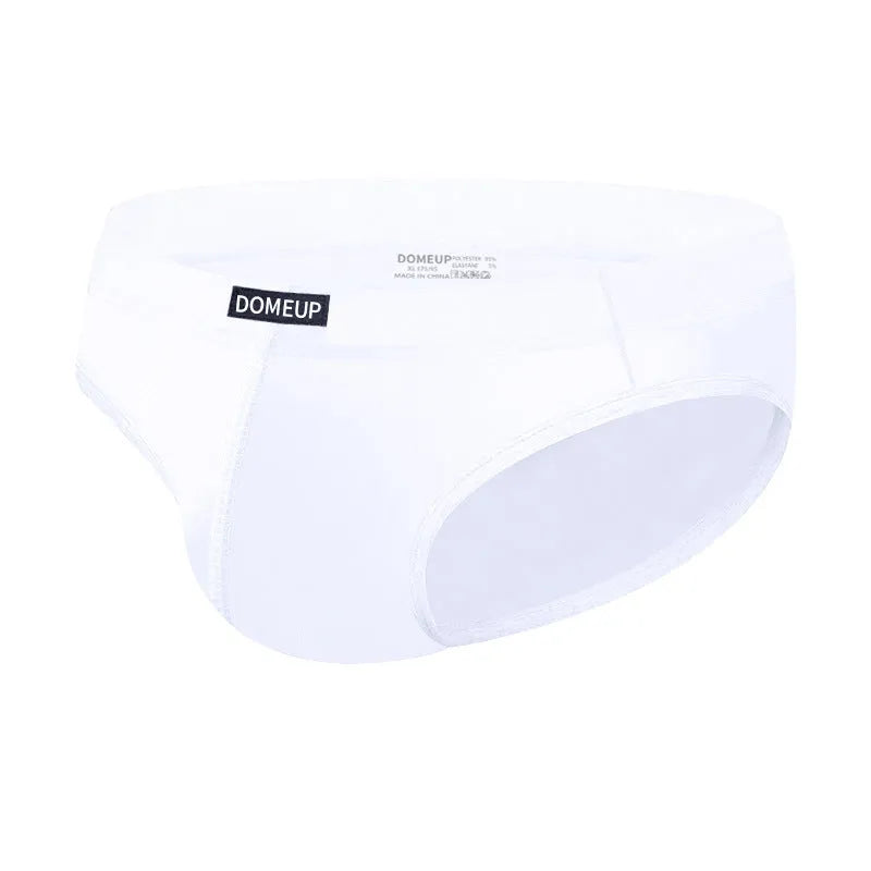 Men's solid colour low waist seamless briefs in black, white, and pink with breathable polyester fabric