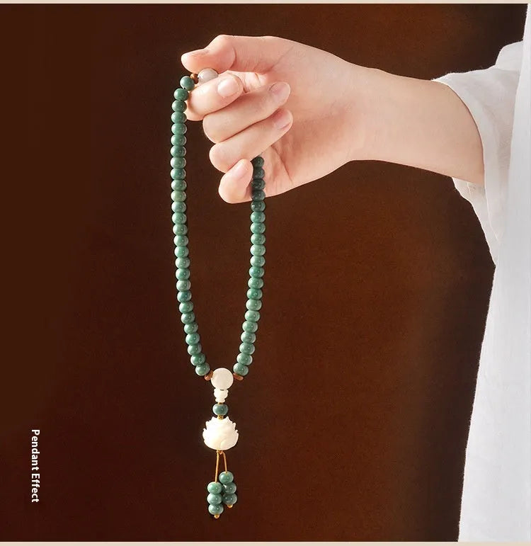 White jade and bodhi seed beaded bracelet with a double ring safety buckle clasp.