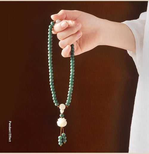 White jade and bodhi seed beaded bracelet with a double ring safety buckle clasp.