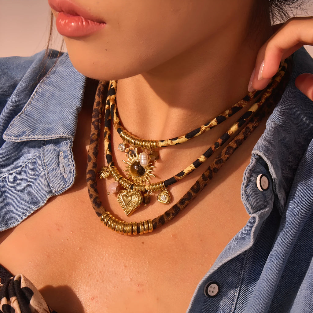 Geometric leopard pendant necklace with gold electroplated finish on adjustable stainless steel chain