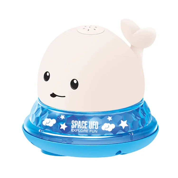 White and blue whale-shaped bath toy with water spray and LED lights floating in water