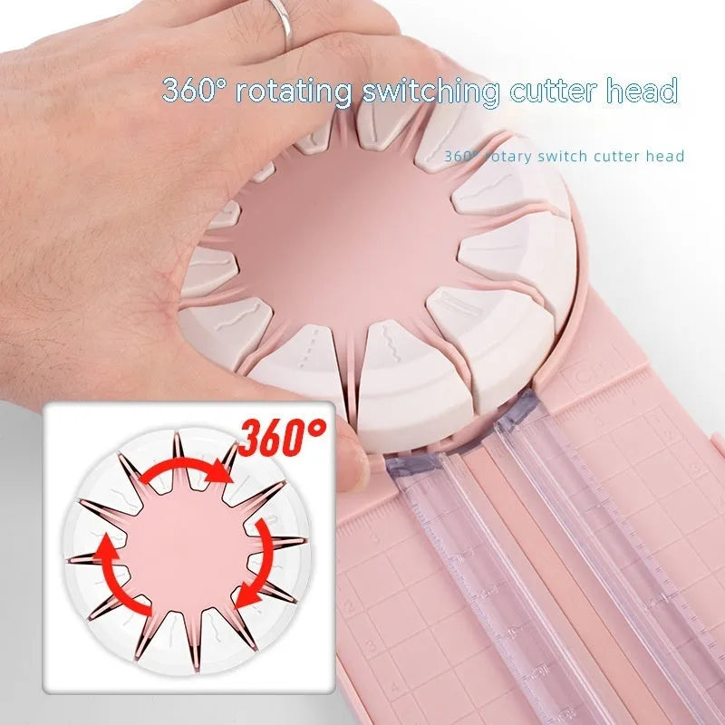 Pink 12-in-1 dotted line paper cutting machine on desktop for card making and scrapbooking