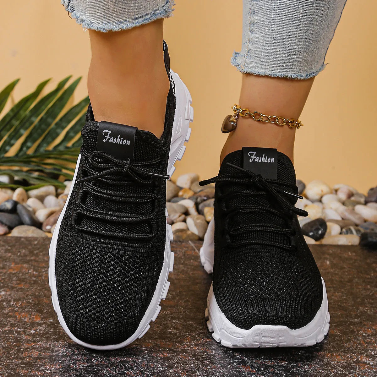 Women's low-top mesh sports shoes in a solid colour with a platform sole and front lace-up design.