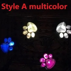 Black solar powered animal paw print LED garden lights set of four with solar panel pole