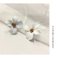 Women's flower stud earrings in pink and white colour options with electroplated alloy construction
