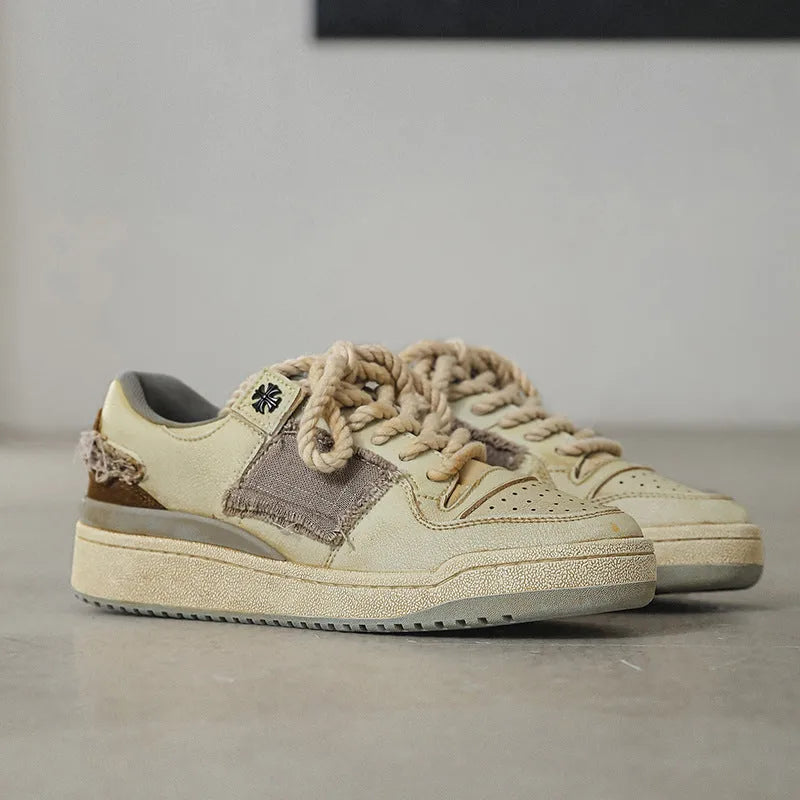 Beige vintage low-top skateboard shoes with round toe and lace-up front
