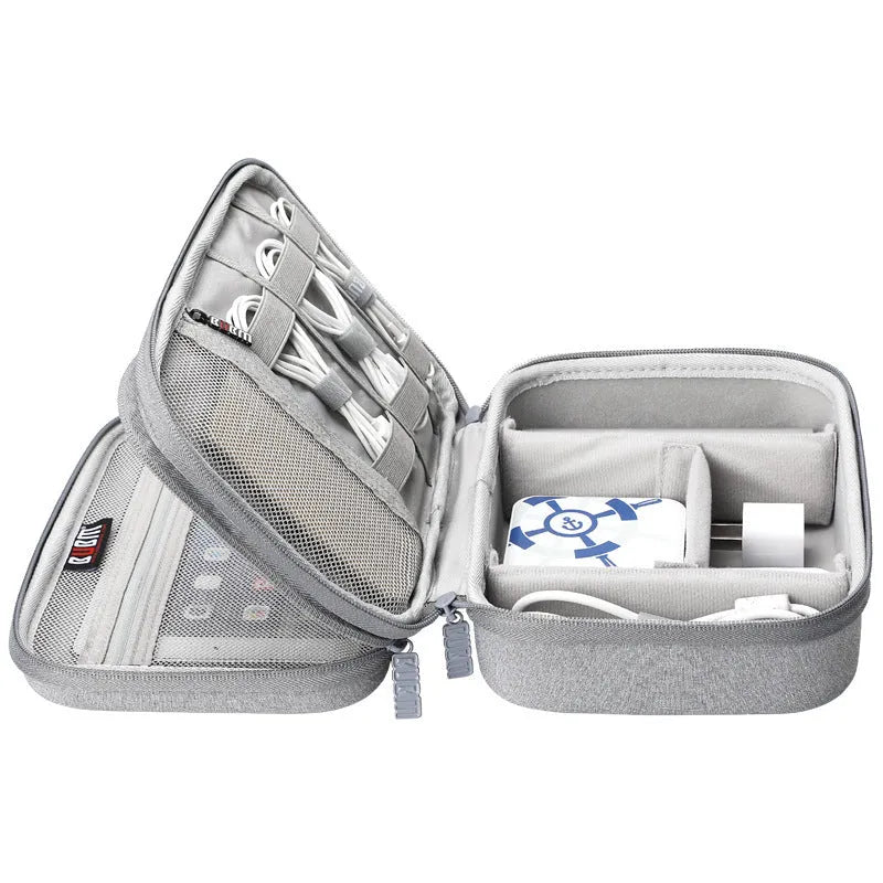 Black EVA digital storage bag with headset storage compartments open showing organisation for cables and accessories