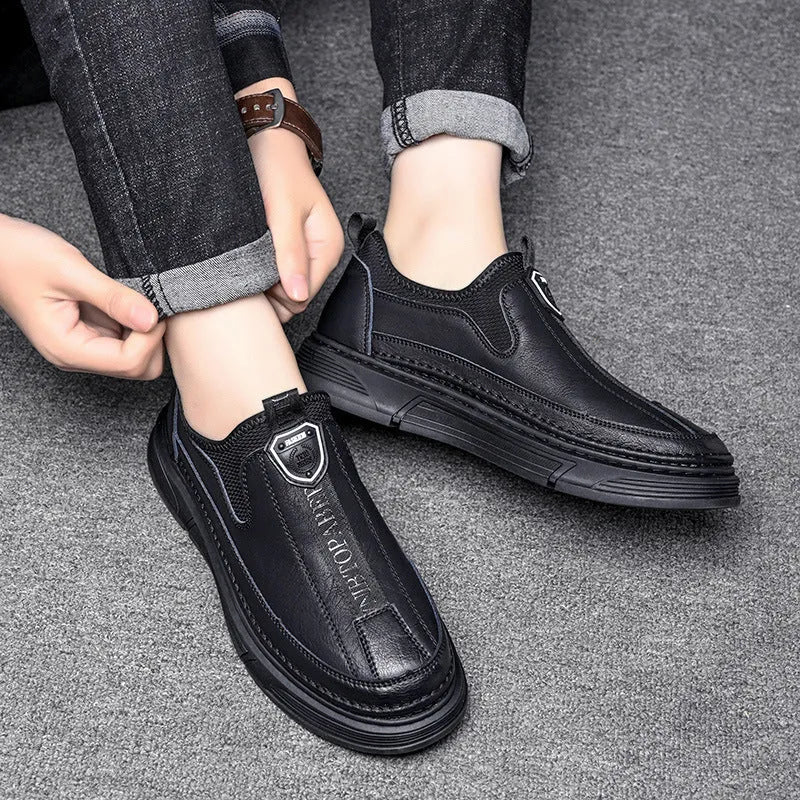 Men's black and brown solid colour leather casual shoes with round toe.