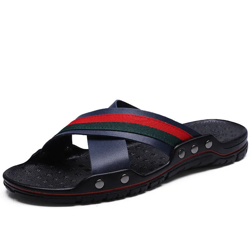 Men's cowhide leather beach sandals in white, shown from a side angle on a sandy background.