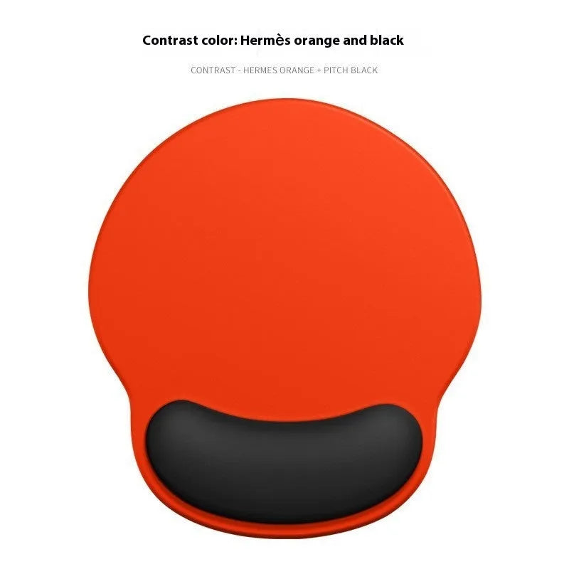 Silicone mouse mat with attached gel wrist support in a gradient blue colour on a desk.