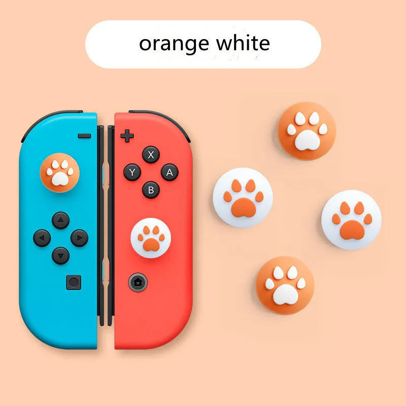 Four silicone rocker caps for Nintendo consoles in various colour combinations