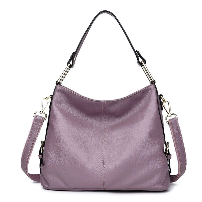 Genuine leather women's crossbody bag in square vertical design, showing internal zipped phone and document pockets.