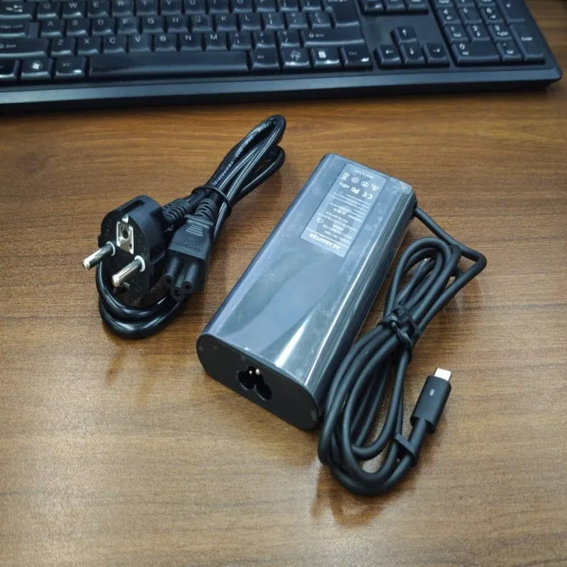 Black 65W USB Type-C laptop power adapter with international power cords