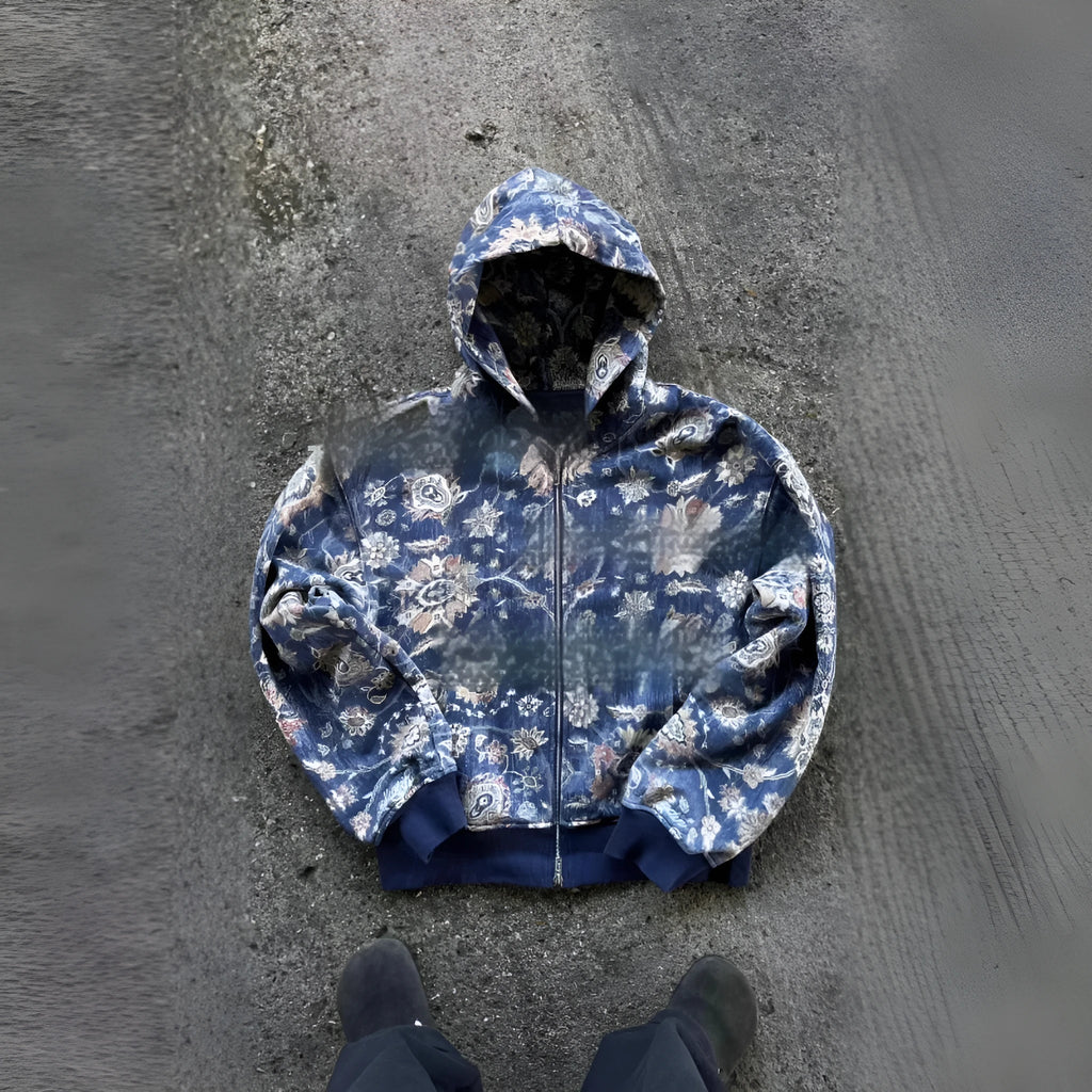 Man wearing a blue loose-fit hooded zip coat with digital print, long sleeves, for casual autumn wear.