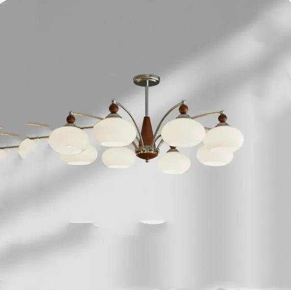 Persimmon glass and chrome chandelier with multiple lampshades in a Middle Ancient style