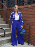 Grey striped streetwear two-piece set featuring a sweater with regular sleeves and matching trousers.