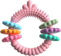 Blue green pink TPR rubber molar stick dog chew toy for small dogs on a white background