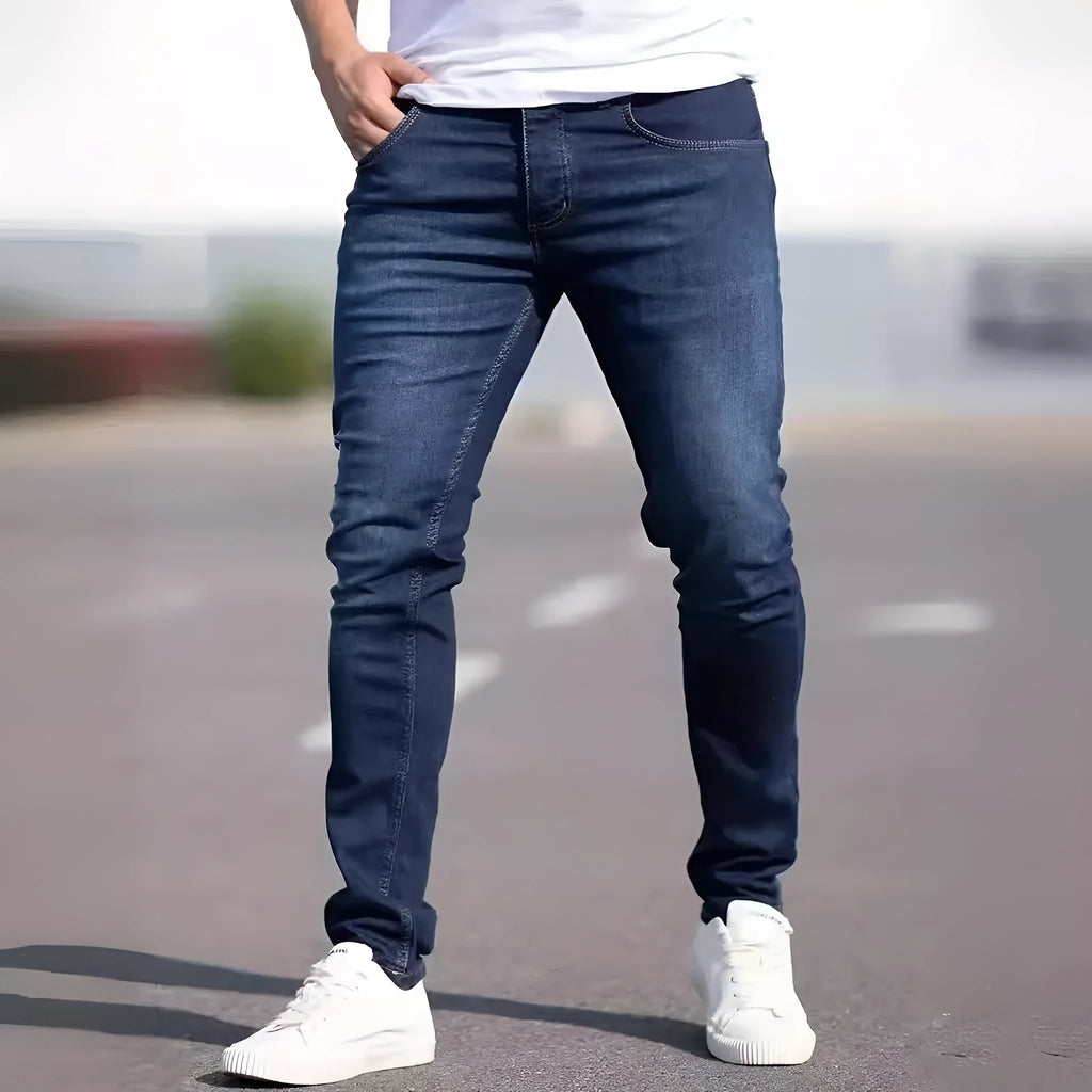 Men's slim fit dark blue jeans with skinny leg design and mid waist cut