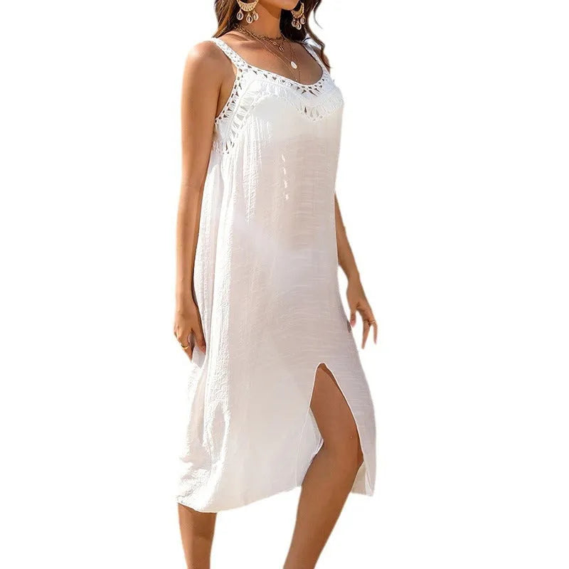 White women's crochet beach dress with suspender straps and a bottom split hem
