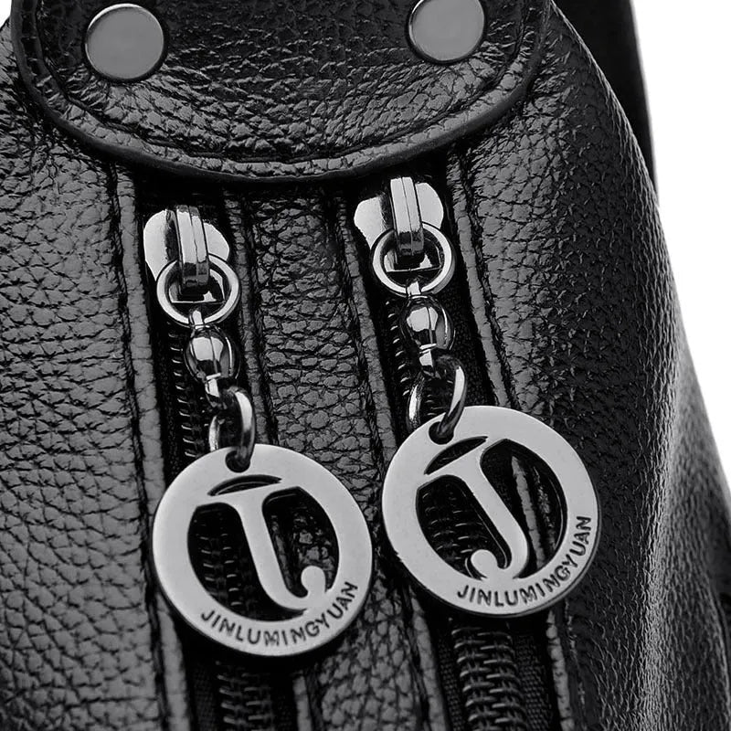 Large black PU shoulder bag with crossbody strap showing multiple internal compartments and zipper closure