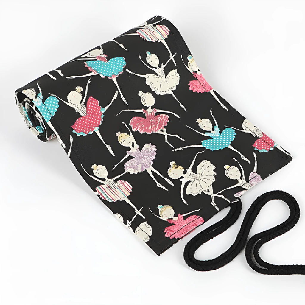 Square canvas pencil case with ballet girl print, showing multiple holes for storing sketching pencils and colour leads.