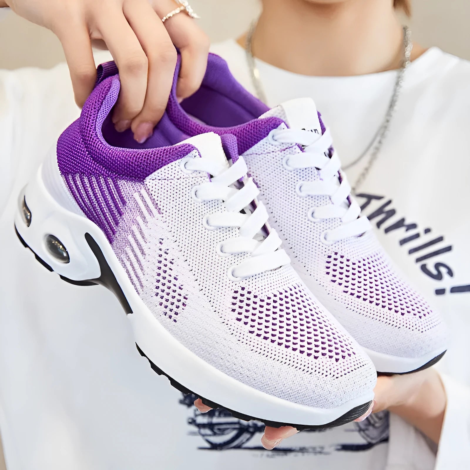 Women's pink Flyknit casual running shoes with mesh lining and flat PVC sole.