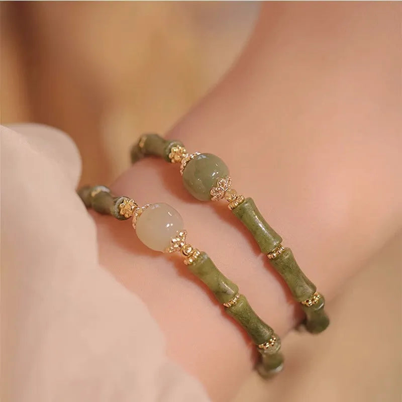 Simple geometric Hetian jade bracelet for women with round beads in dark green and light colour options.
