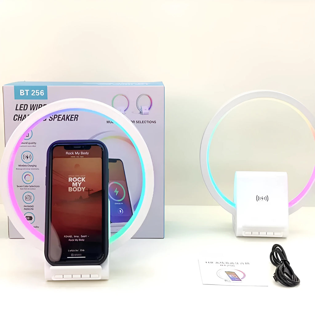 White Bluetooth speaker with wireless charging surface and ambient lighting
