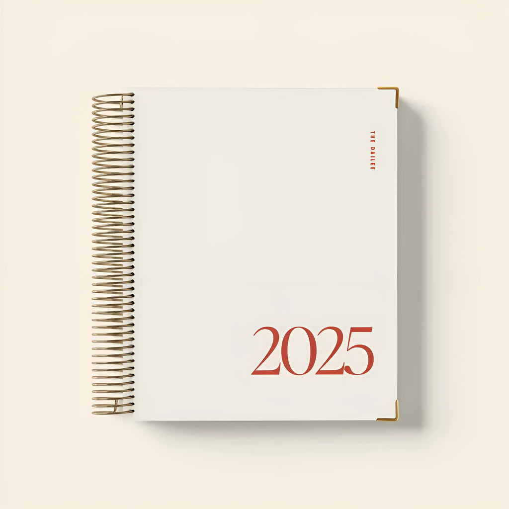 Cherry Red coil notebook with spiral binding open on a desk
