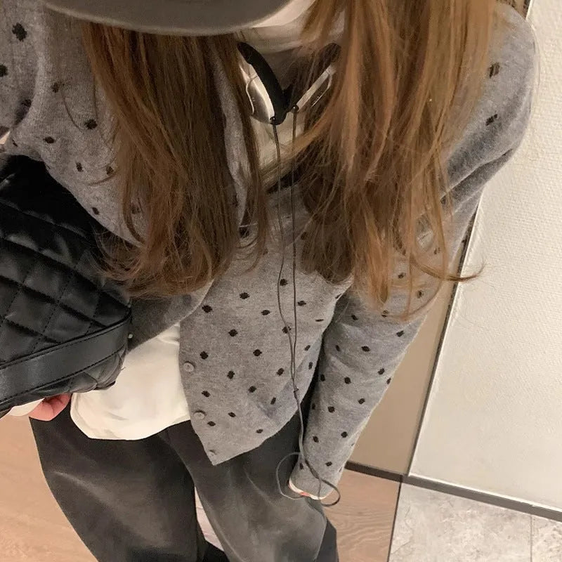 Women's grey dot knit viscose cardigan with crocheted flower details and long sleeves