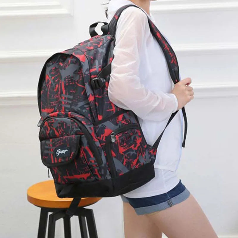 Blue large nylon backpack with adjustable straps on a plain background.