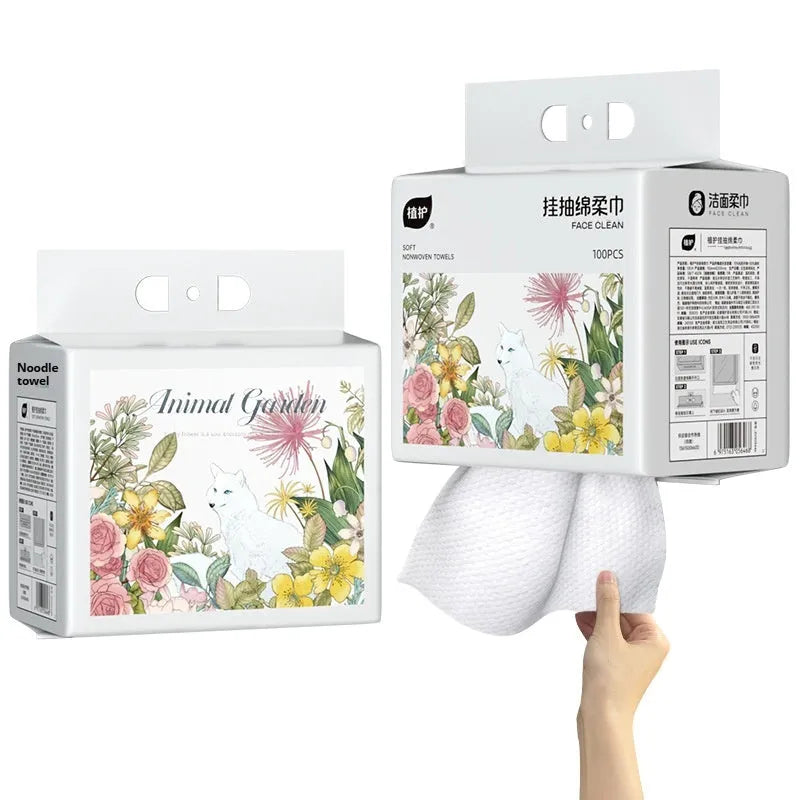 A roll of disposable soft white face cloths made from viscose and polyester blend.