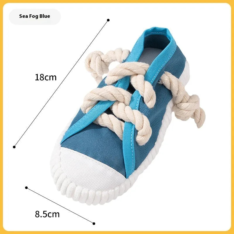 Plastic slipper-shaped dog chew toy in yellow colour for teething relief