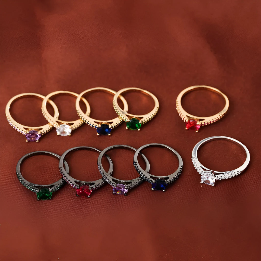 Hexagon geometric zircon ring on a finger, showing electroplated gold rose red colour and copper band.
