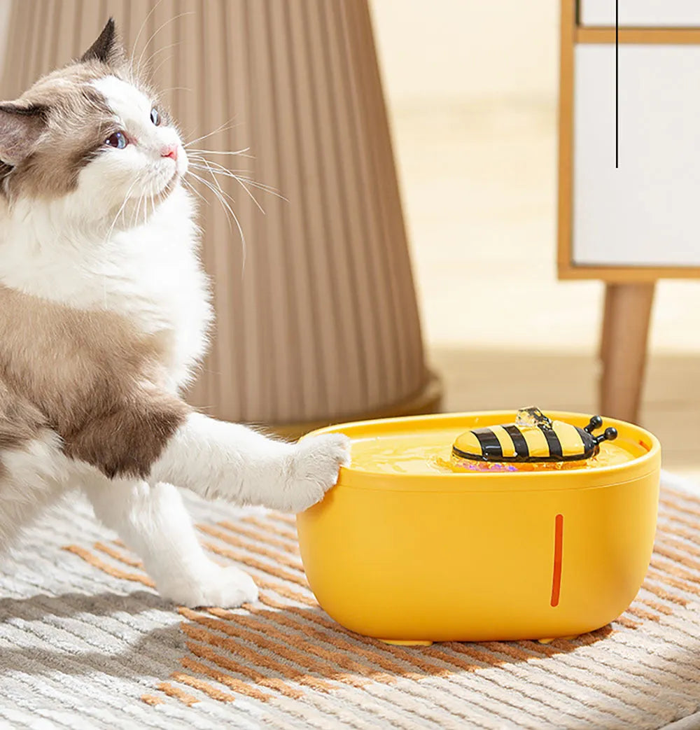 Yellow cat water fountain with filter, water level window, and anti-slip base.