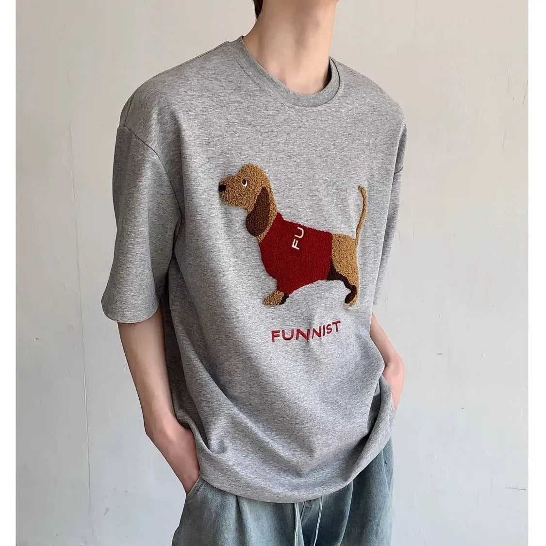 Grey men's t-shirt with embroidered sausage dog in a towel design on the front.