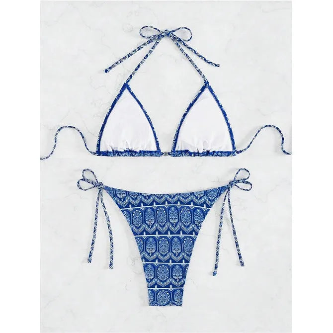 Women's green bandage style bikini swimsuit with split stitching detail on polyester fabric.