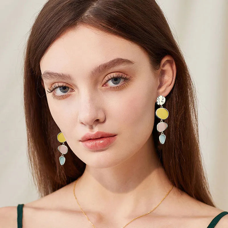 Morandi three-colour oil drip finish on disc-shaped alloy earrings with sterling silver posts.