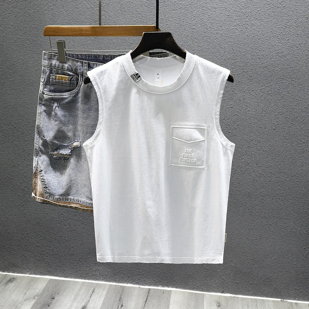 A black loose-fit cotton sleeveless t-shirt with a straight hem, laid flat.