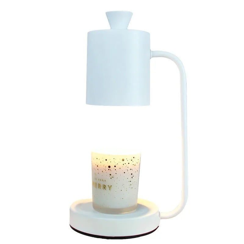 European-style white metal aromatherapy wax melting lamp with dimmer switch on table.