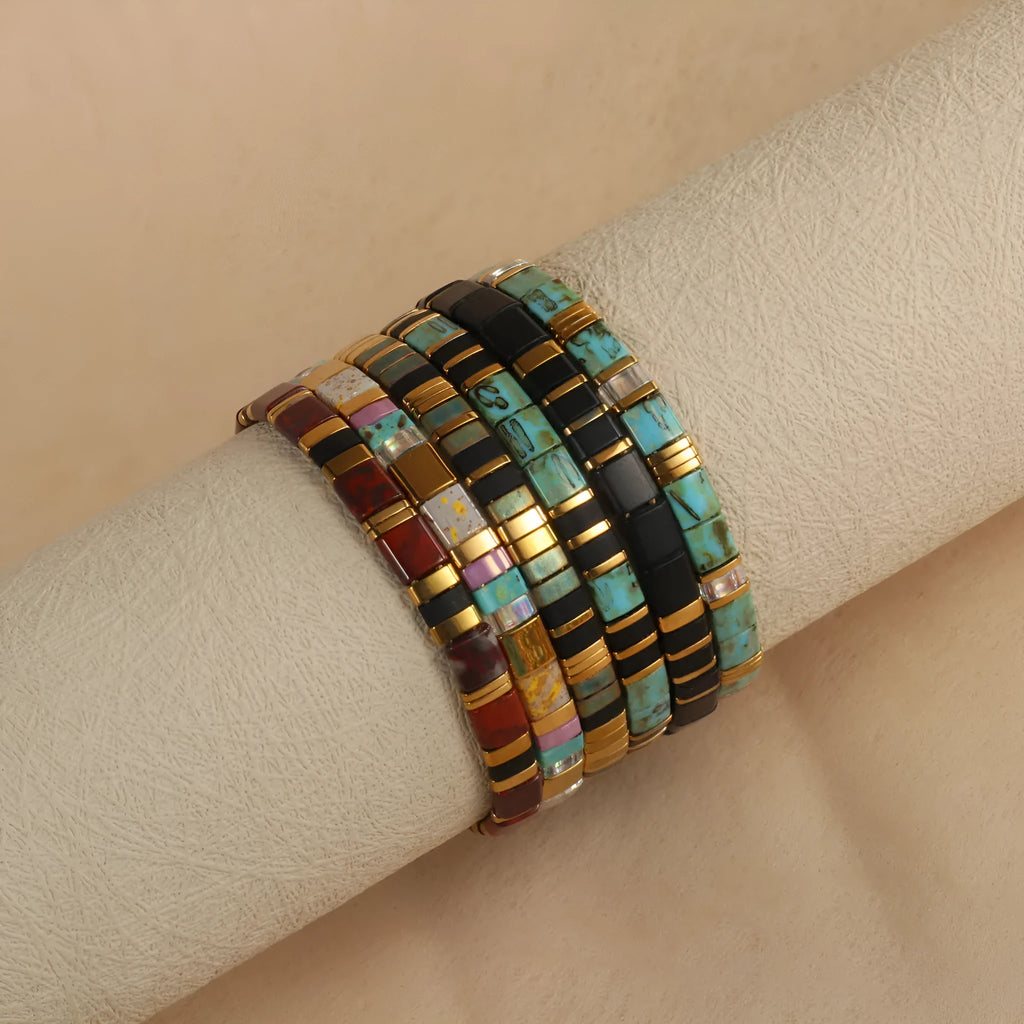 Geometric glass pull bead bracelet in five colour options on wrist