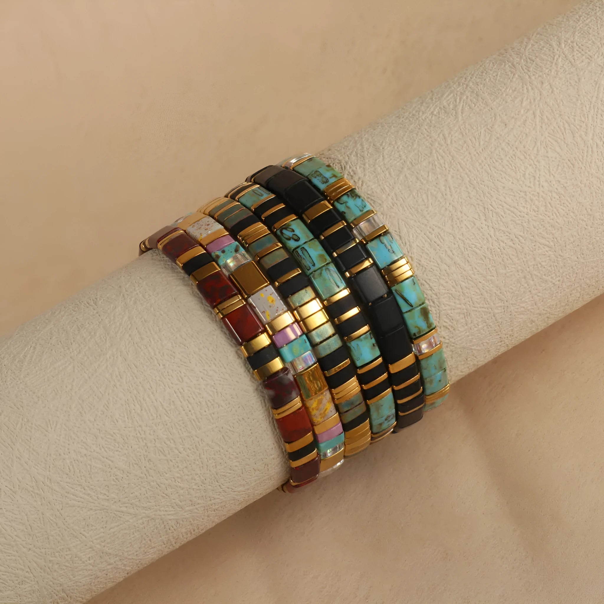 Geometric glass pull bead bracelet in five colour options on wrist
